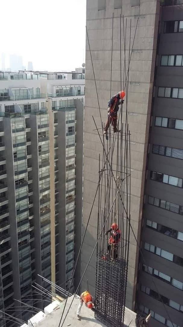 High-rise rebar installation workers